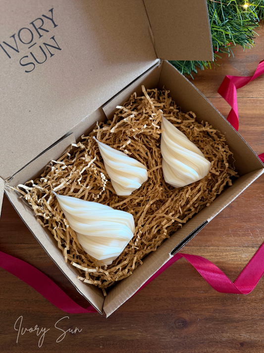 Three beautifully twisted Christmas candles styled together, creating a festive sculptural display for the home. Handcrafted in Australia from premium soy wax or Australian beeswax, these decorative and non toxic candles add a modern touch to Christmas décor and table styling. Available as scented soy candles with pure essential oils, these Xmas Trees Candles Australia make beautiful Christmas candles, gift ideas for home lovers, housewarming gifts Australia or a charming candle gift box.