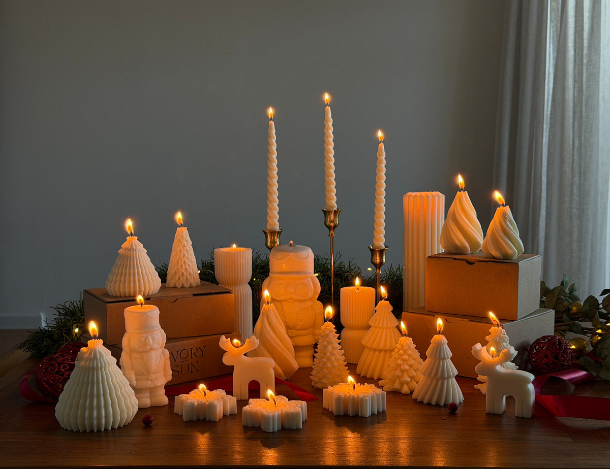 Handmade sculptural Christmas candles by Ivory Sun, featuring elegant Christmas tree, nutcracker, reindeer and snowflake designs. 