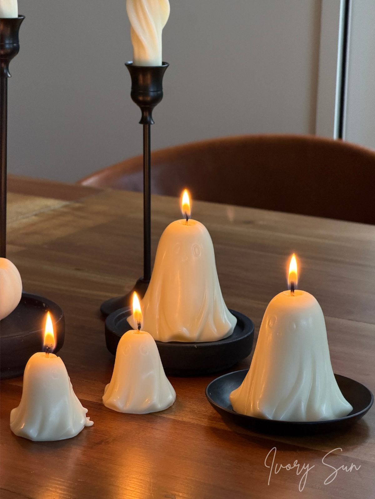 Four Little Ghost Halloween Candles in soy wax, in small and mini sizes. Handcrafted sculptural ghost candles creating a warm and playful Halloween display, perfect for seasonal décor, table styling and cosy gatherings. Australian-made handmade soy candles by Ivory Sun Studio.
