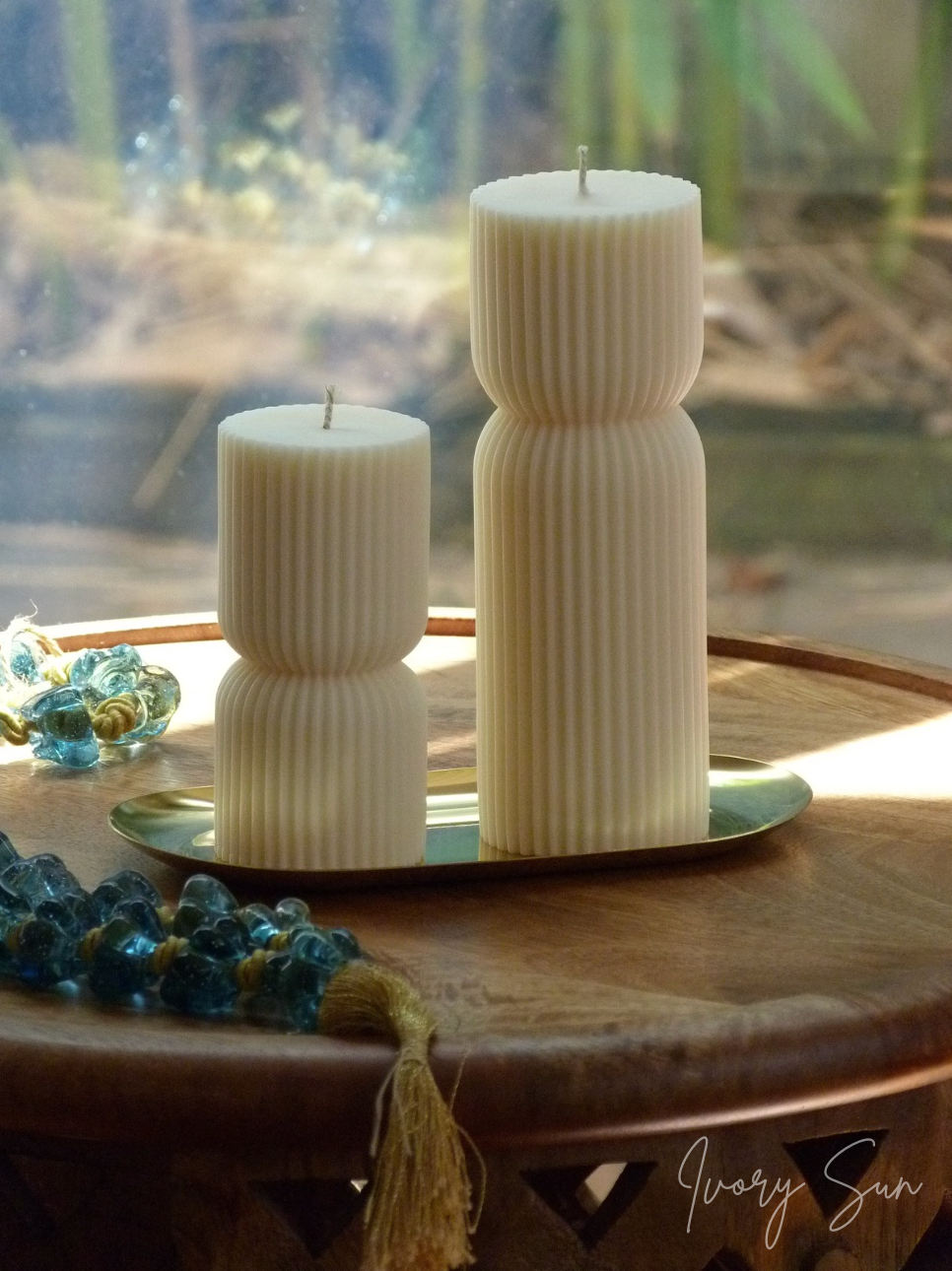 Two ribbed candles on a golden oval metal tray with a blurred natural background.
Gold oval tray on a wooden surface.
metal candle tray, gold candle tray, golden candle tray, golden candle plate, oval candle tray, candle tray australia, candle holder, candle holder australia, ivory sun candle holder, candle accessories