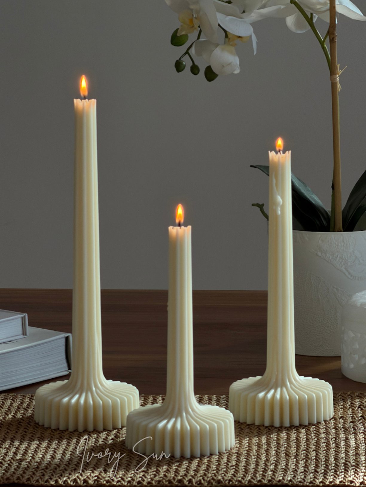 Three cream-colored ribbed candlesticks with lit flame-shaped candles.
Lumi Candle, sculptural candle, pilar candle, soy candle, scented soy candle, essential oils candle, beeswax candle, non toxic candles, decor candles, Sculptural candles Australia
Decorative candles Australia
Beeswax candles Australia
Handcrafted soy candles
Modern candles Australia
Book candles Australia
Gift ideas for home lovers 
Housewarming gifts Australia
Sculptural Candles
Candles
Candles Australia
