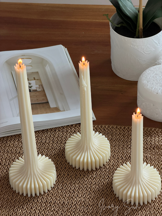 Three cream-colored ribbed candlesticks with lit flame-shaped candles.
Lumi Candle, sculptural candle, pilar candle, soy candle, scented soy candle, essential oils candle, beeswax candle, non toxic candles, decor candles, Sculptural candles Australia
Decorative candles Australia
Beeswax candles Australia
Handcrafted soy candles
Modern candles Australia
Book candles Australia
Gift ideas for home lovers 
Housewarming gifts Australia
Sculptural Candles
Candles
Candles Australia